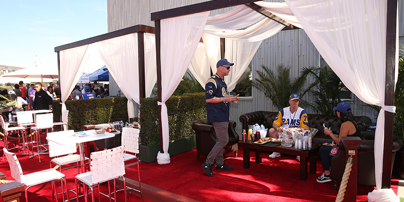VIP Tailgate Cabana with open sides and people enjoying event